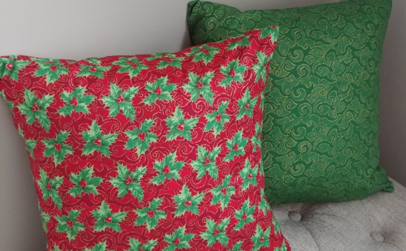 Throw pilllows covered with pretty Christmas fabric.
